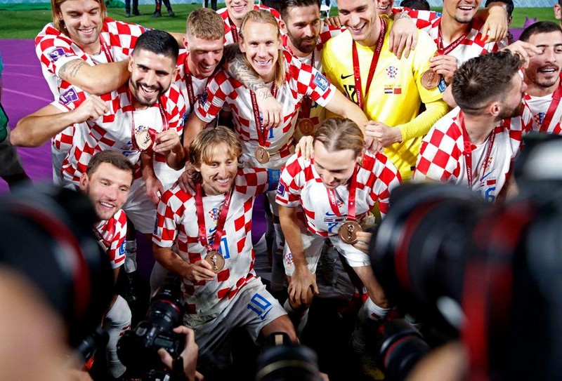 Croatia's Luka Modric and teammates celebrate with their medals as they finish in third place (Photo: REUTERS)