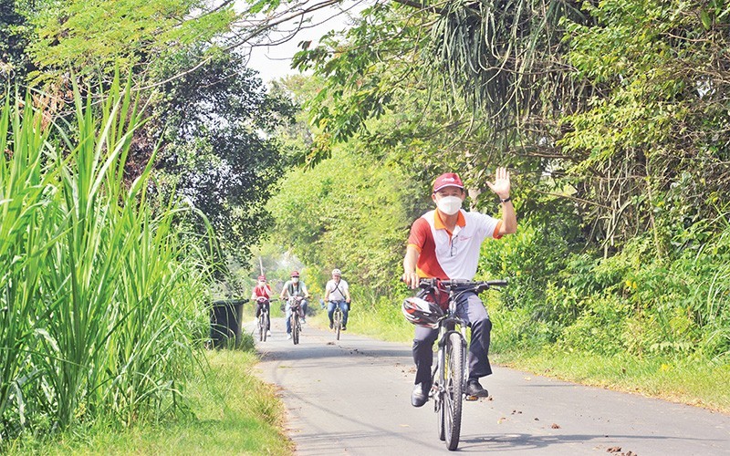 Visitors join a bicycle tour in the Cu Chi district.