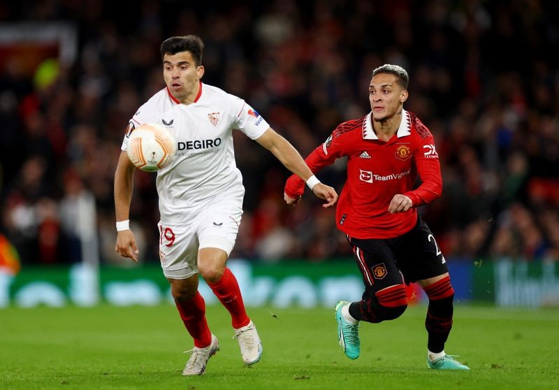 Manchester United's Antony in action with Sevilla's Marcos Acuna during their sides' Europa League quarter-final first leg match at Old Trafford on Apr 13, 2023. (Photo: Reuters/Action Images)