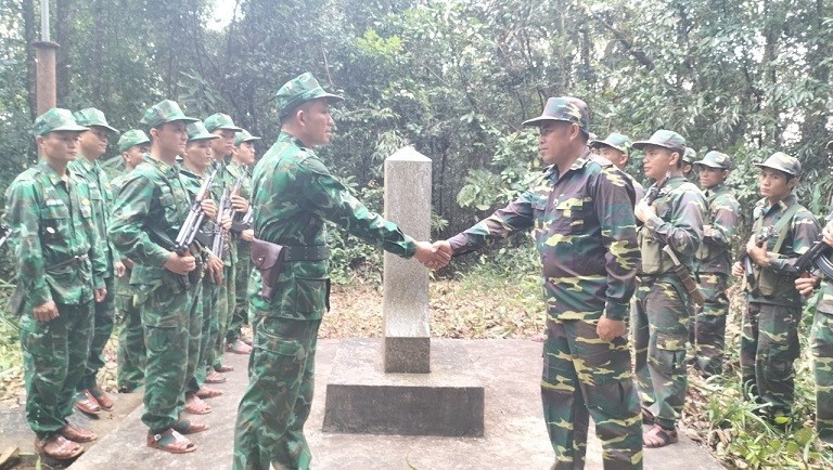 Vietnam and Laos border guards inspect the situation of Marker No. 455