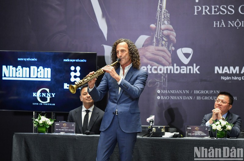 Saxophonist Kenny G performs at the press conference 