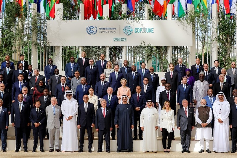 Delegates to the COP 28 pose for a group photo in Dubai. (Photo: COP28)