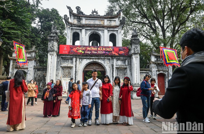 A family pose at the entrance gate to the Temple of Literature.