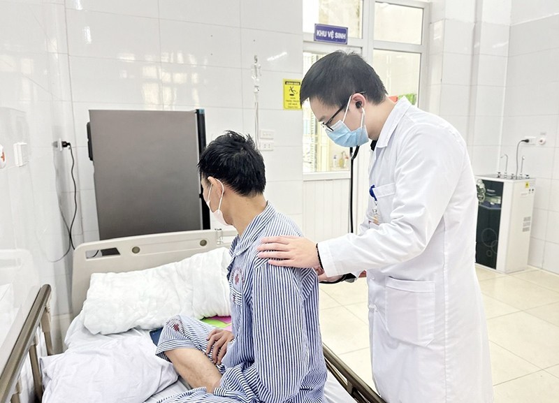 A doctor provides an examination for a patient with tuberculosis at the Central Lung Hospital.