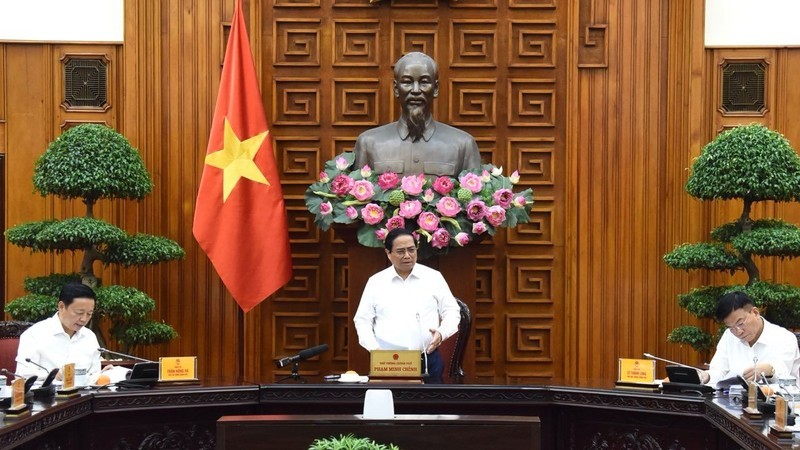 PM Pham Minh Chinh speaks at the meeting between permanent Government members and representatives of ministries and sectors on August 16. (Photo: NDO/Tran Hai)