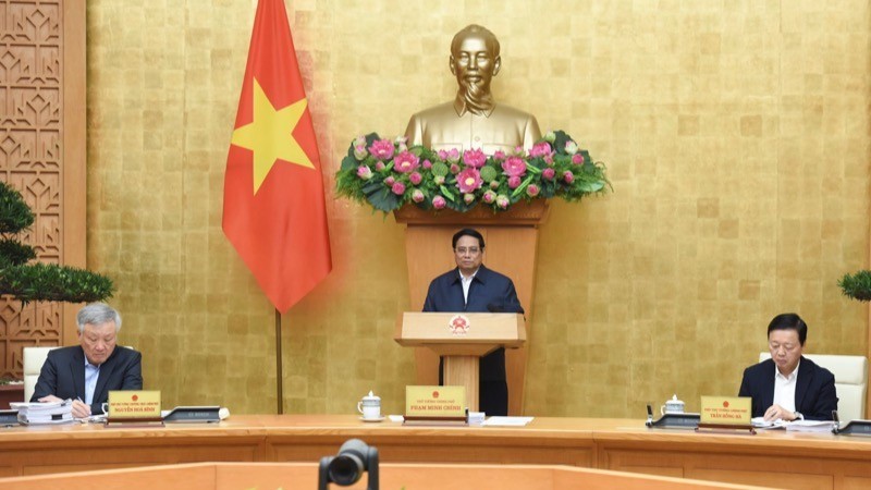 Prime Minister Pham Minh Chinh chairs the Government's monthly regular meeting on December 7. (Photo: NDO)