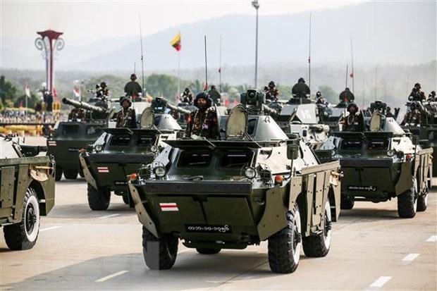Military vehicles participate in a parade to celebrate the 77th Armed Forces Day in Nay Pyi Taw, Myanmar. (Photo: AFP/VNA)