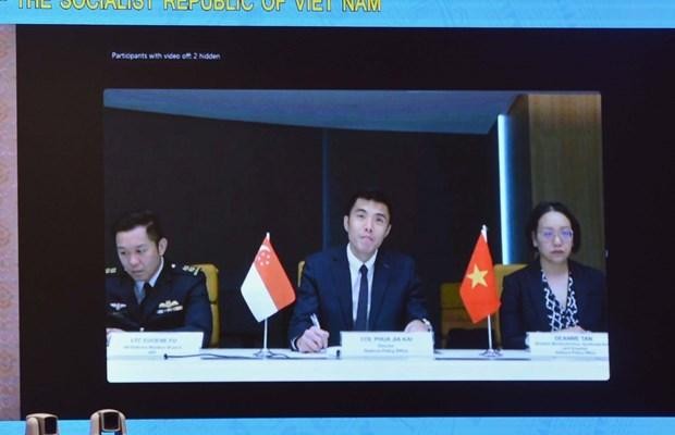 The 10th meeting of the Vietnam - Singapore joint working group on defence cooperation held virtually on October 25. (Photo: VNA)