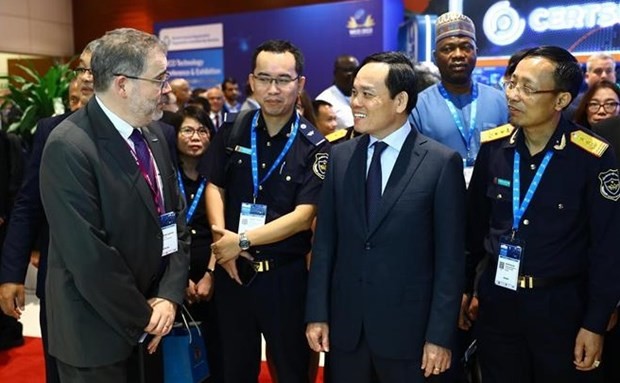 Deputy Prime Minister Tran Luu Quang (second, right) visits the WCO Technology Exhibition. (Photo: VNA) 