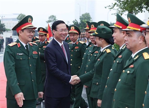 President Vo Van Thuong (second, left) and leaders of the Military Industry and Telecoms Group (Viettel) in Hanoi on February 1. (Photo: VNA)