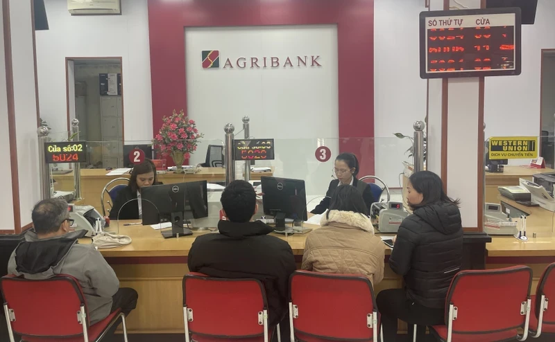Customers make transactions at an Agribank branch.