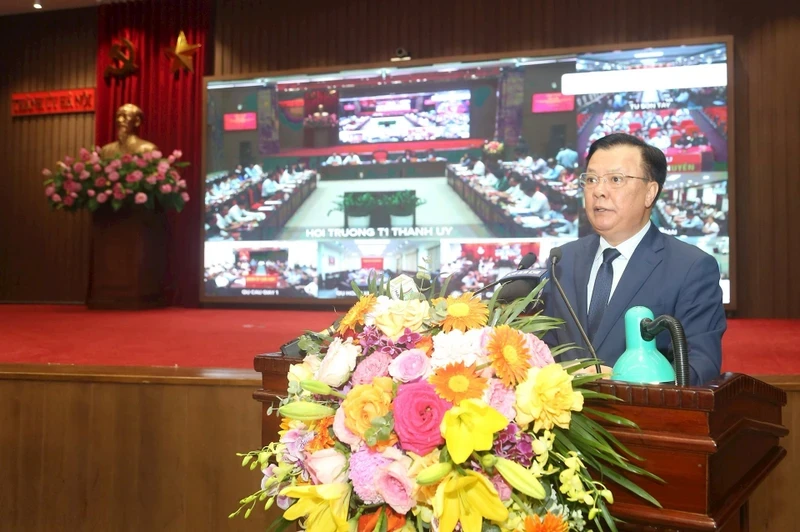 Politburo member and Secretary of Hanoi Party Committee Dinh Tien Dung speaks at the conference. 