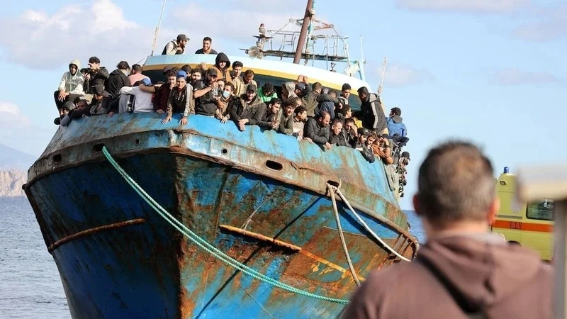 Illustrative image: Migrants stand on a fishing boat at the port of Palaiochora during a rescue operation off the island of Crete, Greece, on November 22, 2022. (Photo: REUTERS)