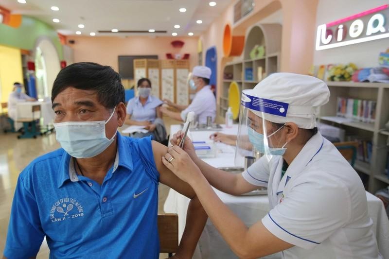 A man is vaccinated against COVID-19.