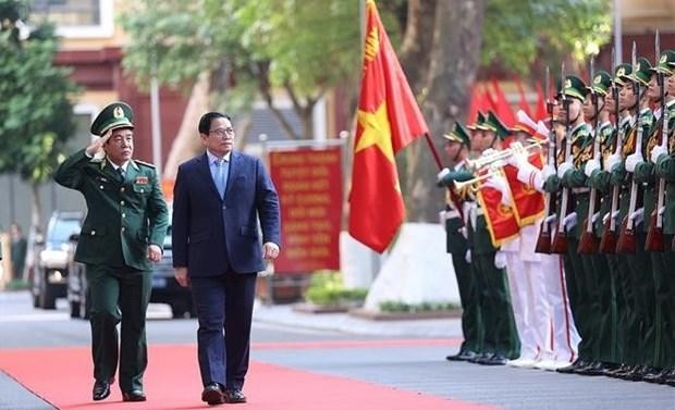 PM Pham Minh Chinh reviews the guard of honour while visiting the Border Guard High Command in Hanoi on December 18. (Photo: VNA)