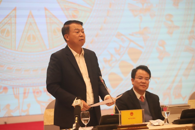 Deputy Minister of Finance Nguyen Duc Chi speaks at the event. (Photo: Ha Noi Moi) 