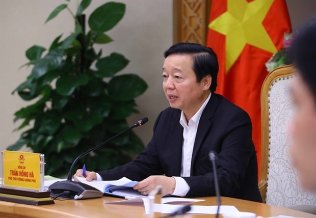 Deputy Prime Minister Tran Hong Ha speaks at the meeting on the progress of essential works in Long Thanh International Airport. (Photo: VNA)