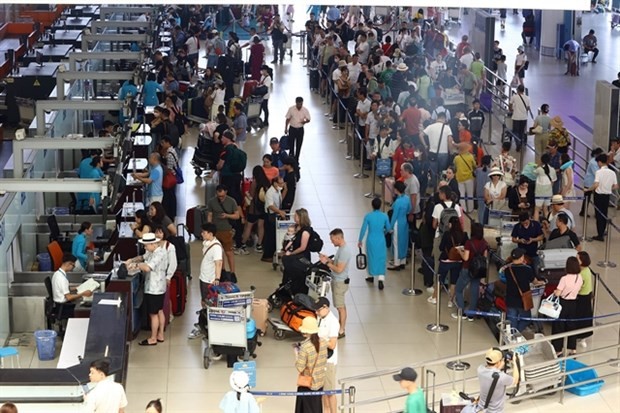 Passengers at the domestic terminal of Noi Bai International Airport in Hanoi. (Photo: VNA)