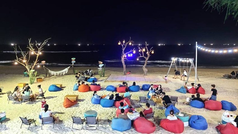 Tourists enjoy a cool night by the beach in Quang Binh.