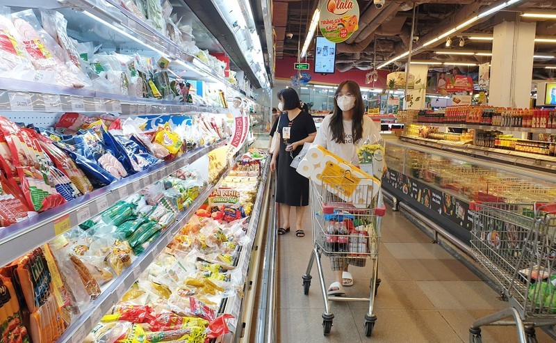 Consumers shop for goods at a supermarket.