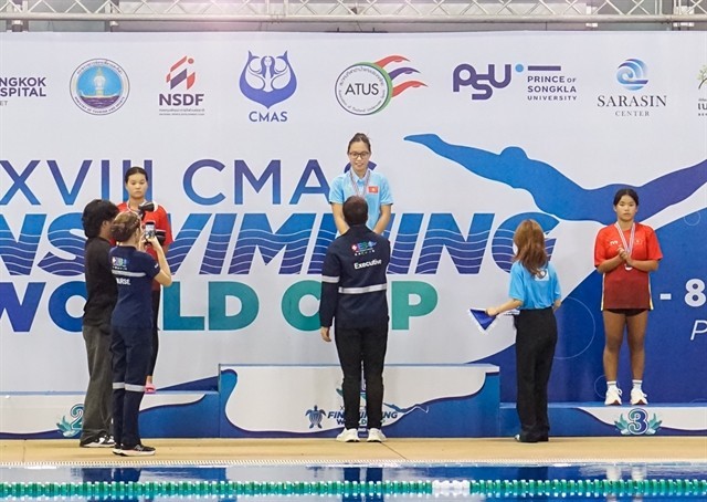 Vietnamese Nguyen Tran San San (top podium) and two teammates at the victory ceremony of the girls' 12-17 year-old 1,500m surface at the 18th CMAS Finswimming World Cup 2024 Round 4 in Phuket, Thailand (Photo: HCMC Finswimming)