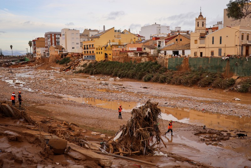 Rescue workers walk, following heavy rains that caused floods, in Paiporta, near Valencia, Spain, November 1, 2024. (Photo: Reuters)