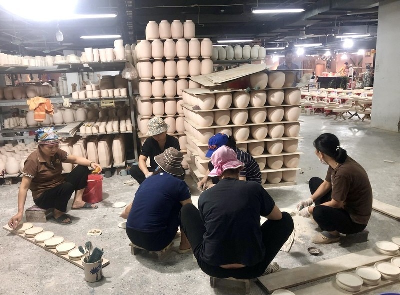 Manufacturing pottery at Bat Trang ceramic village.