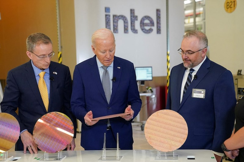 US President Joe Biden looks at a wafer, as he tours the Intel Ocotillo Campus, in Chandler, Arizona, US, on March 20, 2024. (Photo: Reuters)