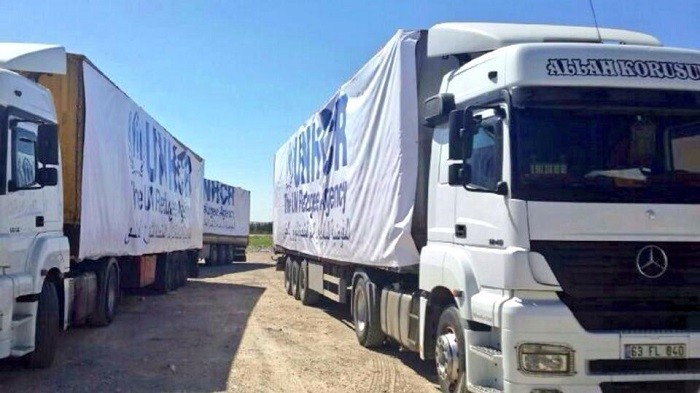 The International Organization for Migration (IOM) said that 14 trucks carrying humanitarian aid had crossed into northern Syria from Turkey on Friday.