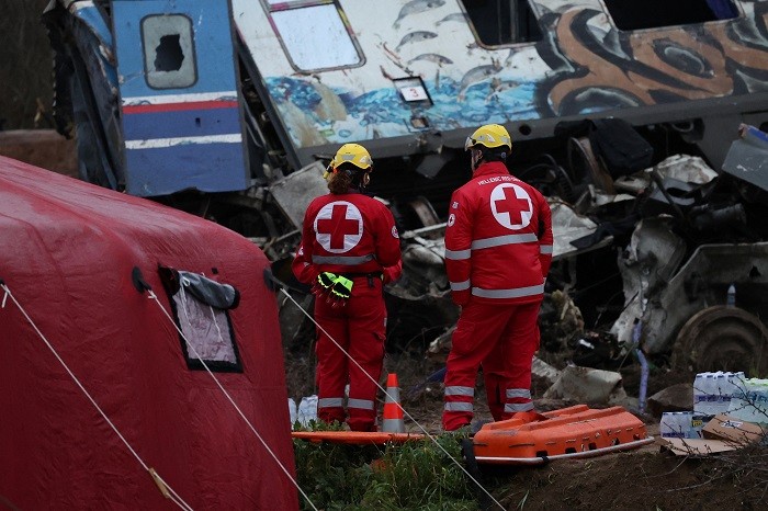 Rescuers combed through charred and buckled rail carriages for more victims of Greece's deadliest train crash on Thursday, a disaster that killed at least 46 people and has led to a national outpouring of grief and anger.