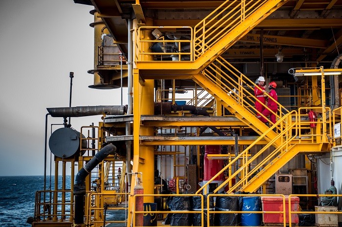 Workers work on an offshore oil platform in the Persian Gulf. (Photo: Bloomberg)