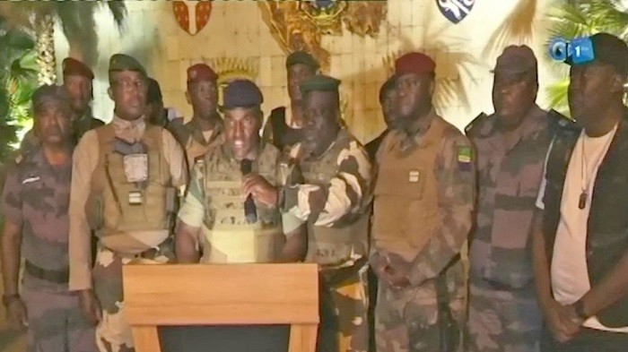 This video grab taken from Gabon 24 shows Gabonese soldiers appearing on television on August 30, 2023 announcing they were “putting an end to the current regime” and the cancellation of an election that, according to official results, President Ali Bongo Ondimba won. (Source: AFP/GETTY IMAGES)