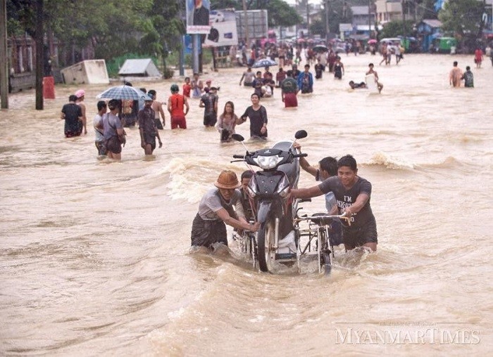 Floods displaced more than 2,500 households in several towns of northern Myanmar following heavy rains and rising river levels, official daily Myanma Alinn reported on Wednesday.