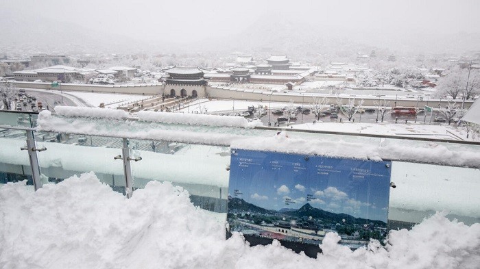 South Korea grappled with heavy snowfall for a second day on Thursday, with dozens of flights cancelled, ferry operations suspended and at least five people reported dead in a cold snap, though conditions showed signs of easing.