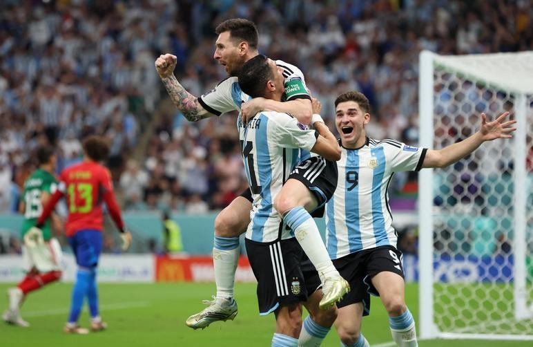 Argentina’s Lionel Messi celebrates their first goal with Angel Di Maria and Julian Alvarez against Mexico. (Photo: Reuters) 