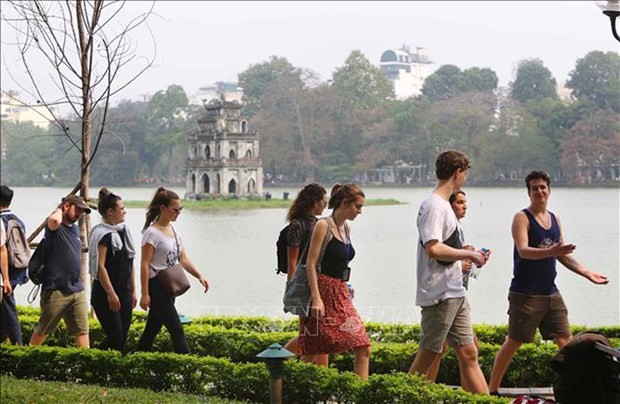 Foreigners visit Ha Noi's downtown area. (Photo: VNA)