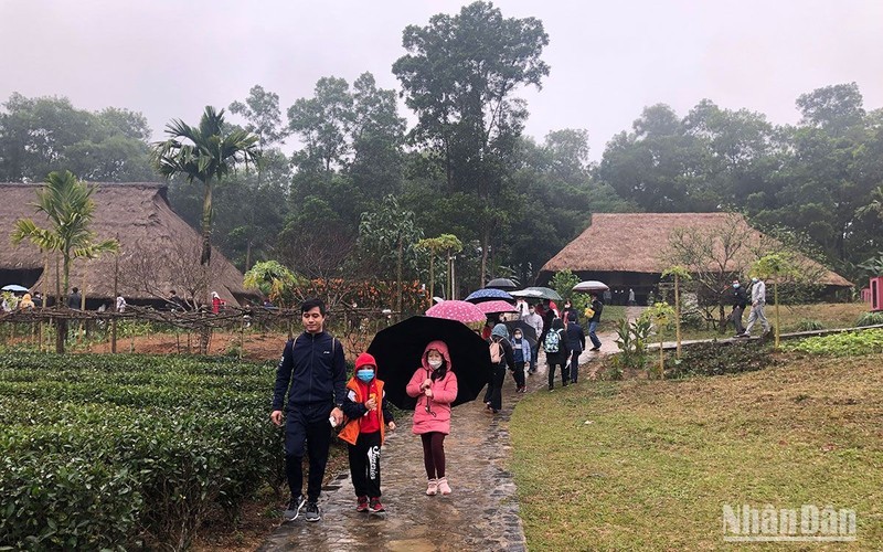 Visitors to the Vietnam National Village for Ethnic Culture and Tourism