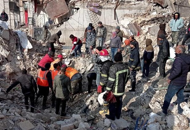 Search and rescue force works to find victims of the earthquake in al-Masharqa, Aleppo, north Syria, on February 7, 2023. (Photo: Xinhua/VNA)