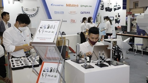 A booth featuring products of the Measurement Equipment Business JSC at the 3rd Vietnam International Supporting Industry and Manufacturing Exhibition. (Photo: VNA)