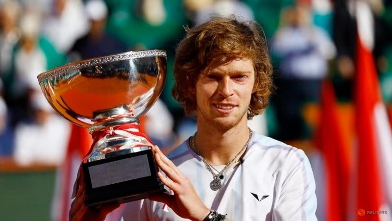 Russia’s Andrey Rublev celebrates with the trophy after winning the Monte Carlo final against Denmark’s Holger Rune on April 16. (Photo: Reuters)