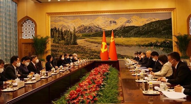 At a meeting between representatives of the two Politburos (Photo: VNA)