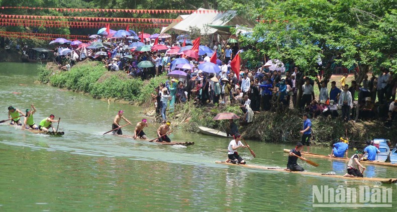 A boat race is held at the festival.
