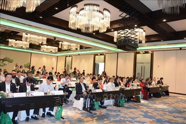 Delegates attend the workshop. (Photo: VNA)