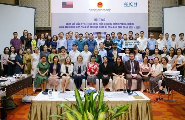 Delegates to the workshop in HCM City on August 9 in a group photo. (Photo: VGP)