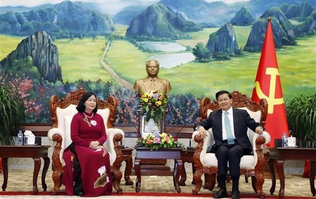 President of Laos Thongloun Sisoulith (R) receives Bui Thi Minh Hoai, Secretary of the Party Central Committee and Chairwoman of its Commission for Mass Mobilisation. (Photo: VNA) 