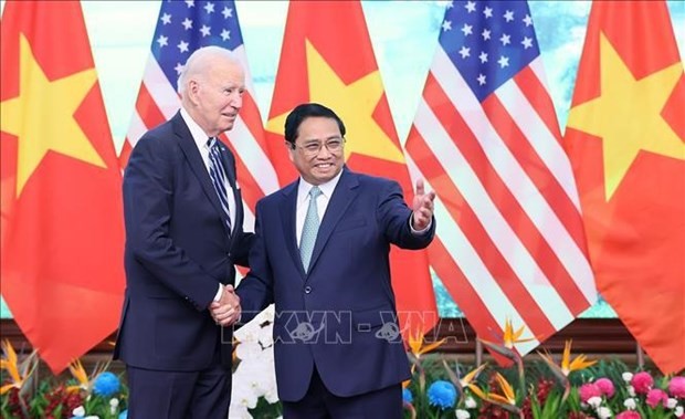 Prime Minister Pham Minh Chinh (right) and US President Joseph Robinette Biden Jr. (Photo: VNA)