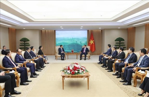 At the meeting between Prime Minister Pham Minh Chinh and Lao Deputy Prime Minister and Foreign Minister Saleumxay Kommasith. (Photo: VNA)