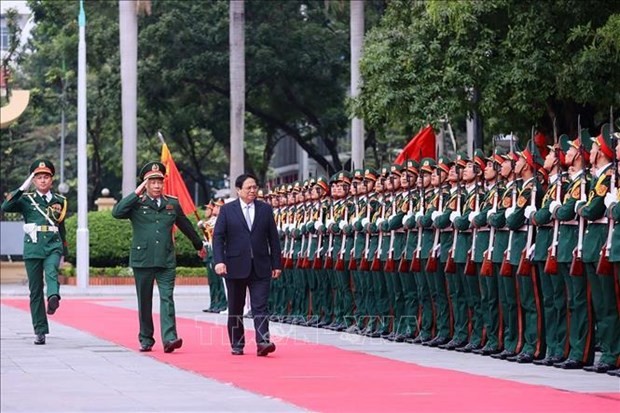 Prime Minister Pham Minh Chinh visits the National Defence Academy. (Photo: VNA)