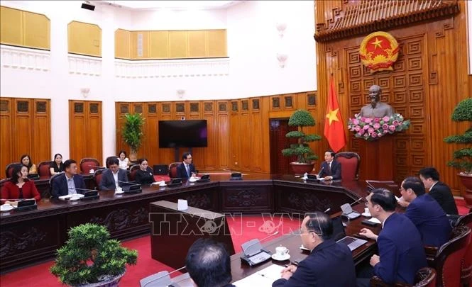 At the meeting in Hanoi on August 12 (Photo: VNA)