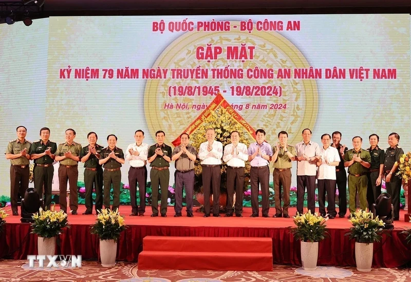 General Secretary and President To Lam and other Party and State leaders attend a meeting to celebrate the 79th anniversary of People's Public Security Forces' Traditional Day. (Photo: VNA)